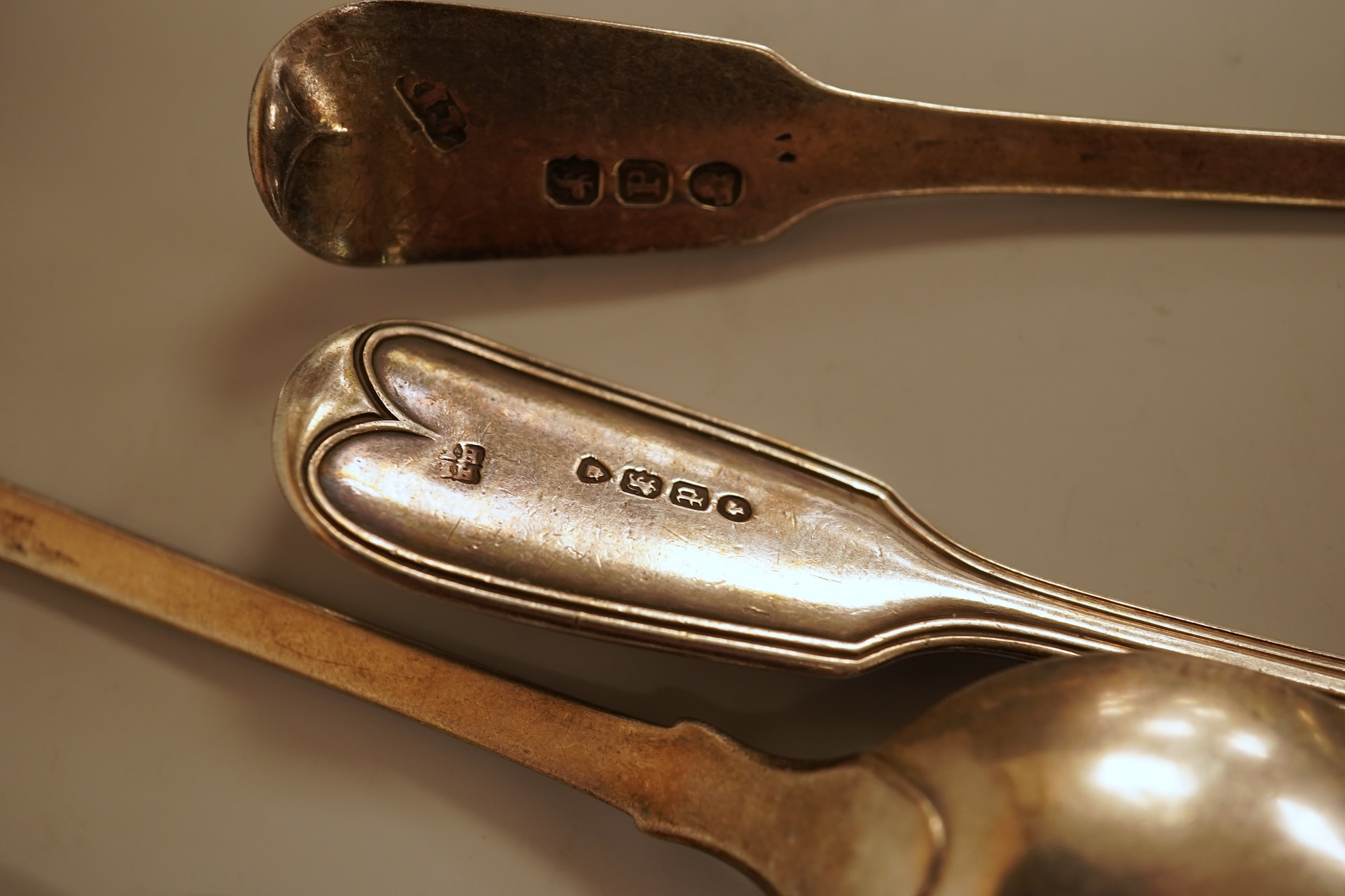 A small quantity of 18th century and later assorted silver teaspoons, various patterns, dates and makers, together with a George V silver pastry fork and two George V silver caddy spoons, 10.7oz.